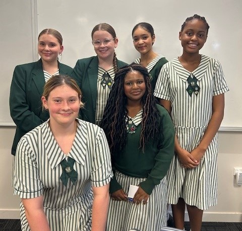 group of students smiling at the camera